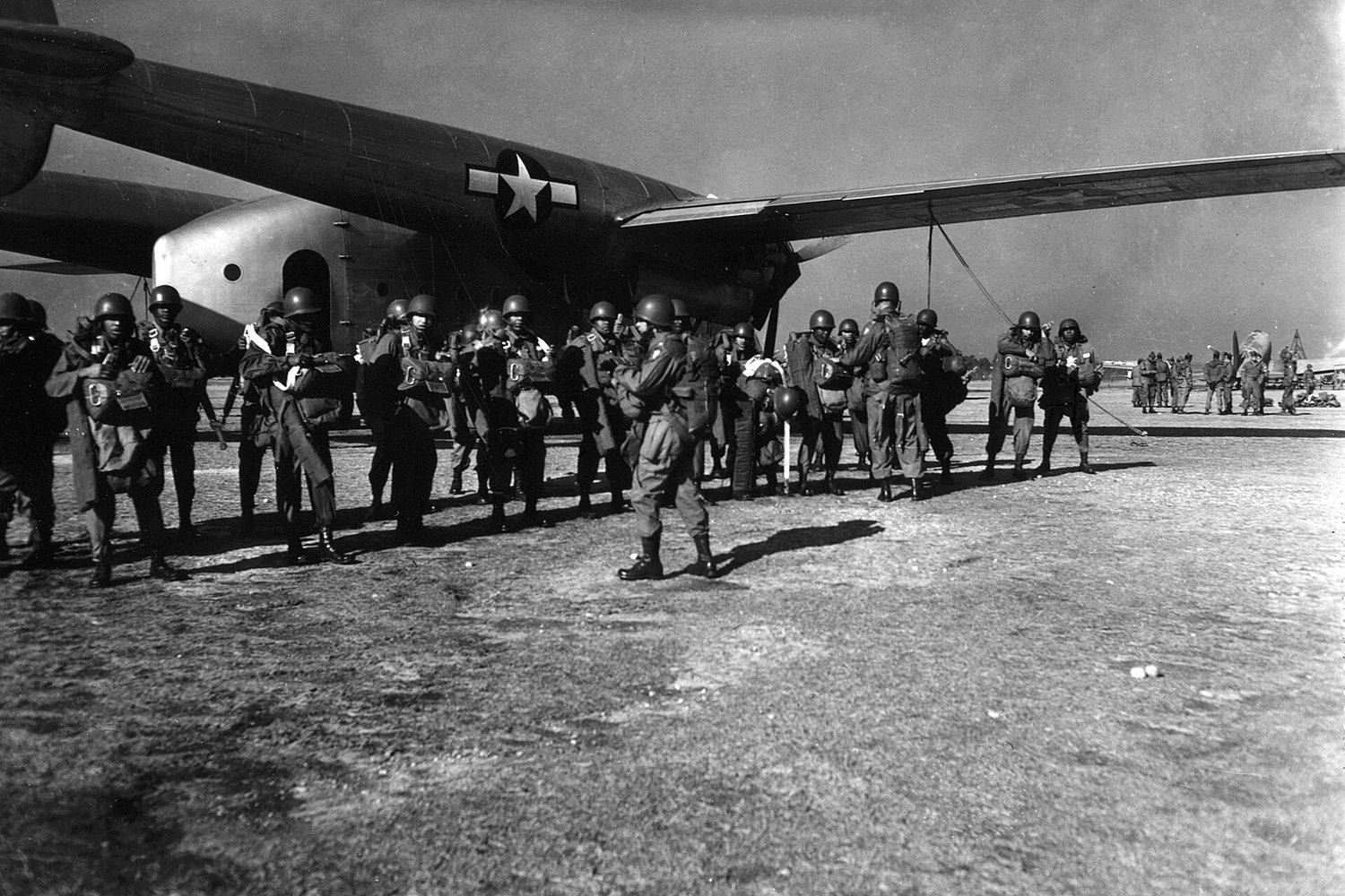 Paratroopers boarding a C-47 transport plane before a jump