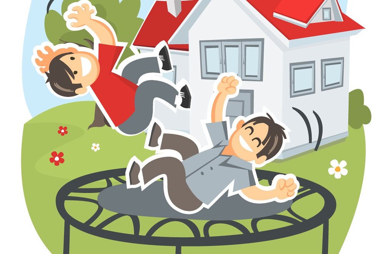 Two children bouncing on a backyard trampoline with a house behind them.